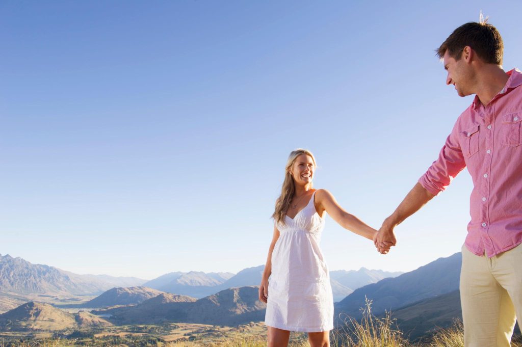 Couple holding hands outdoors after choosing egg donation in South Africa